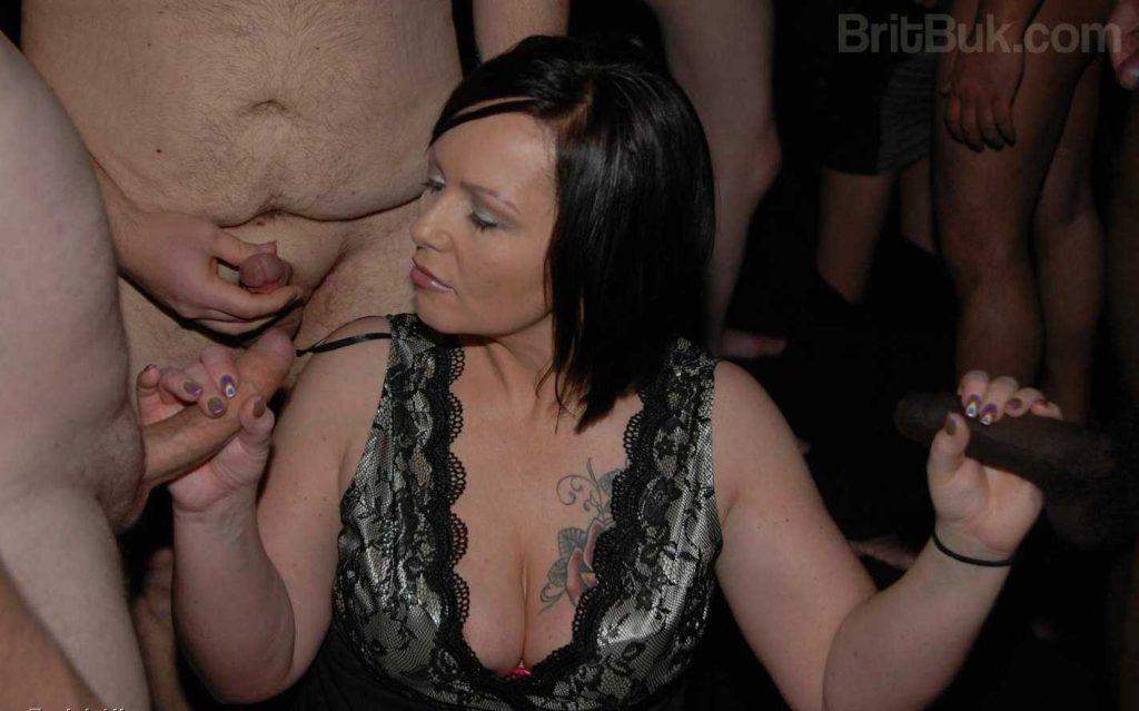 British MILF posing smiling wearing a CUM MASK